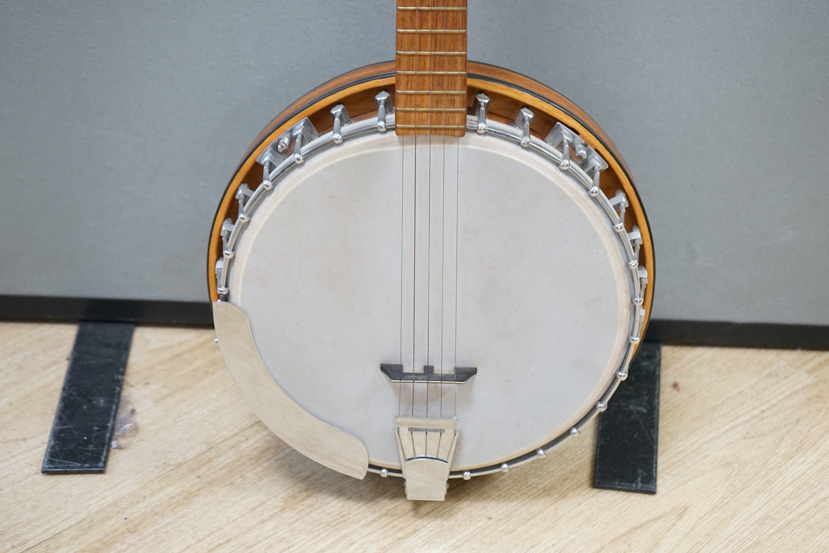 A five string banjo made by John Degay of Degay Guitars